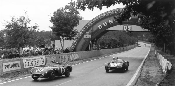 Le Mans, France. 28th - 29th July 1956.
Stirling Moss / Peter Collins (Aston Martin DB3S), 2nd position, leads Ninian Sanderson / Ron Flockhart (Jaguar D-type), 1st position, action. 
World Copyright: LAT Photographic
Ref: 773 - 50.