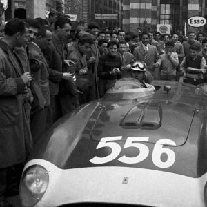 Italian racing driver Luigi Musso sitting in his Ferrari surrounded by the crowd at the Mille Miglia Automobile Race. Brescia April 1956  (Photo by Emilio RonchiniMondadori via Getty Images)