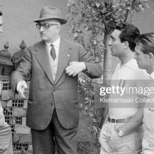 Luigi Musso, Enzo Ferrari, Eugenio Castellotti (the eventual winner) and Peter Collins discuss the upcoming Mille Miglia at Maranello, April 1956. (Photo by Klemantaski Collection/Getty Images)