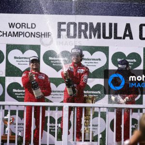 RED BULL RING, AUSTRIA - AUGUST 17: Alain Prost, 1st position, Michele Alboreto, 2nd position, and Stefan Johansson, 3rd position, celebrate on the podium during the Austrian GP at Red Bull Ring on August 17, 1986 in Red Bull Ring, Austria.