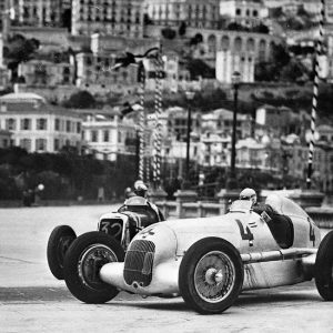 Monaco Grand Prix, April 22, 1935. The winner Luigi Fagioli (car #4) at the wheel of a Mercedes-Benz formula racing car W 25 B, overtaking Luigi "Gigi" Soffietti in a Maserati 8CM 2,9 l (car #32).