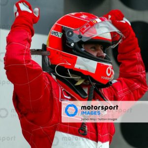 Michael Schumacher (GER) Ferrari F2003-GA celebrates victory in parc ferme.
Formula One World Championship, Rd15, United States Grand Prix, Race Day, Indianapolis, USA, 28 September 2003.
DIGITAL IMAGE
