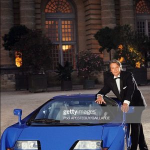 FRANCE - SEPTEMBER 14:  Alain Delon sponsoring the Bugatti EB 110 in Versailles, France on September 14, 1991 - Alain Delon and the Bugatti EB 110 in Versailles.  (Photo by Pool APESTEGUY/GAILLARDE/Gamma-Rapho via Getty Images)