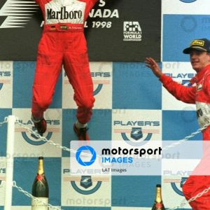 Michael Schumacher jumps for joy after winning the Canadian Grand Prix .... Pic Steve Etherington.
