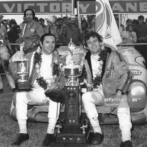 DAYTONA BEACH, FL - JANUARY 31, 1971:  Mexico's Pedro Rodriguez (L) and Jackie Oliver of Great Britain in victory lane after driving John Wyer's Gulf Porsche 917K to victory in the 24 Hours of Daytona at Daytona International Speedway. (Photo by ISC Images & Archives via Getty Images)