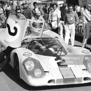 DAYTONA BEACH, FL — January 30, 1971:  Crewmembers push one of the John Wyer Porsche 917Ks to its place in the starting grid for the 24 Hours of Daytona at Daytona International Speedway.  Pedro Rodriguez and Jackie Oliver would drive the car to victory in the event.  (Photo by ISC Images & Archives via Getty Images)