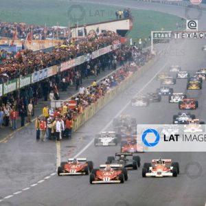 Osterreichring, Zeltweg, Austria. 12th - 14th August 1977.
Niki Lauda (Ferrari 312T2) leads James Hunt (McLaren M26 Ford), Carlos Reutemann (Ferrari 312T2) and Mario Andretti (Lotus Ford) at the start of the race, action. 
World Copyright: LAT Photographic.
Ref: 77 AUT 10.