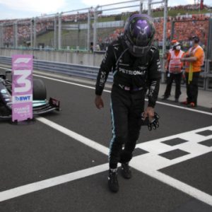 Third placed, Mercedes driver Lewis Hamilton of Britain walks from his car after the Hungarian Formula One Grand Prix, at the Hungaroring racetrack in Mogyorod, Hungary, Sunday, Aug. 1, 2021. (Florion Goga/Pool via AP)