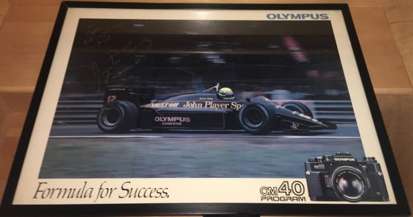 1985 Ayrton Senna Lotus signed Olympus sponsor poster - framed