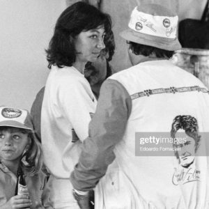 As her daughter Melanie drinks a soda beside her, Joann Villeneuve speaks with a friend during the Formula 1 Italian Grand Prix, Imola, Italy, September 14, 1980. Villeneuve was married to driver Gilles Villeneuve, who was competing in the event. (Photo by Edoardo Fornaciari/Getty Images)