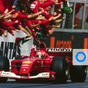 MELBOURNE GRAND PRIX CIRCUIT, AUSTRALIA - MARCH 04: Michael Schumacher, Ferrari F2001, celebrates as he crosses the finish line and takes the chequered flag during the Australian GP at Melbourne Grand Prix Circuit on March 04, 2001 in Melbourne Grand Prix Circuit, Australia. (Photo by LAT Images)