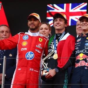 Race winner Andrea Kimi Antonelli of Italy and Mercedes AMG Petronas F1 Team Second placed Lewis Hamilton of Great Britain and Scuderia Ferrari and Third placed Isack Hadjar of France and Oracle Red Bull Racing on the podium during the F1 Grand Prix of Monaco at Circuit de Monaco on June 07, 2026 in Monte-Carlo, Monaco. (Photo by Joe Portlock/Getty Images) // Getty Images / Red Bull Content Pool